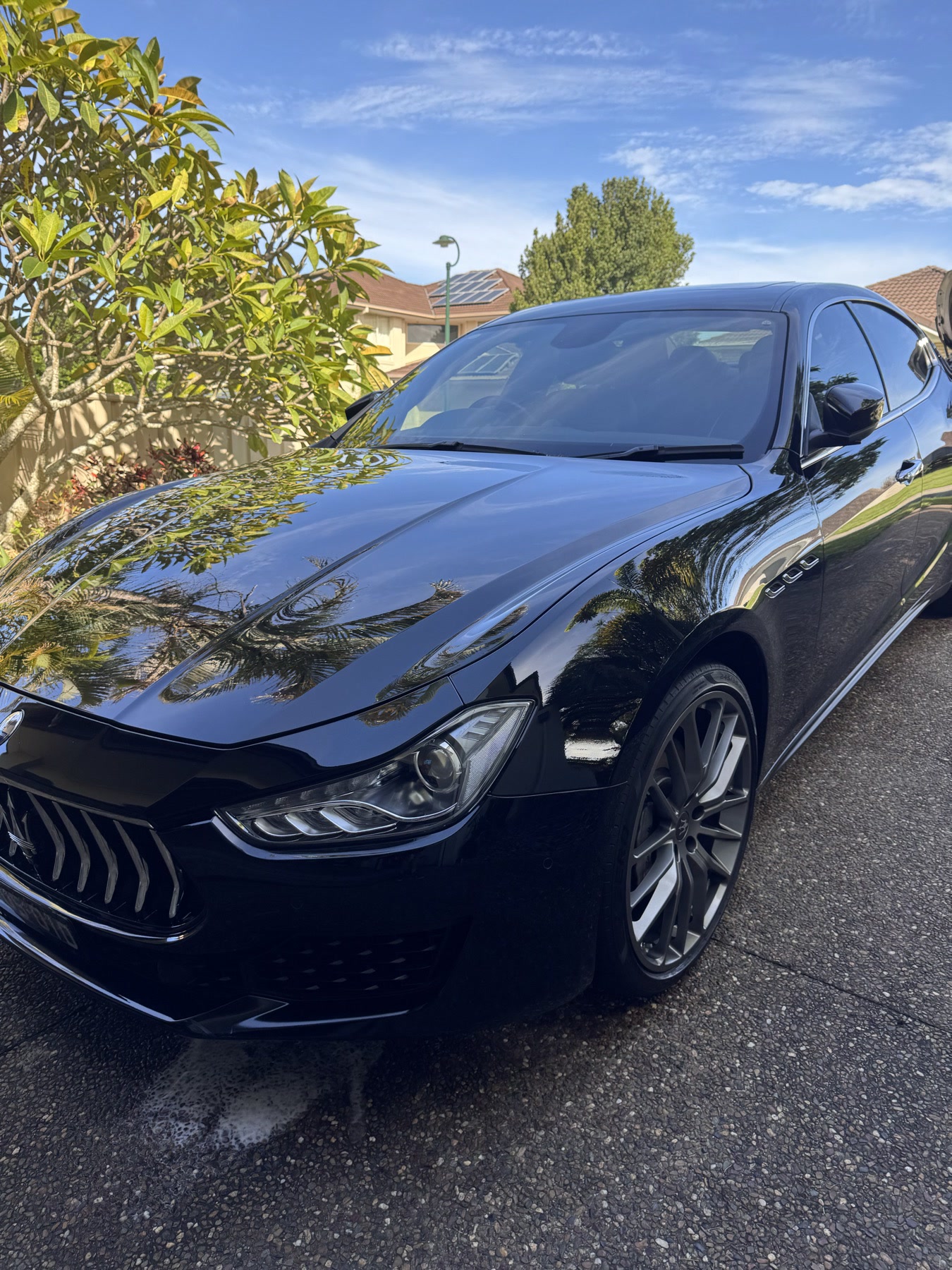 Black car polished by Olly's Auto Shine