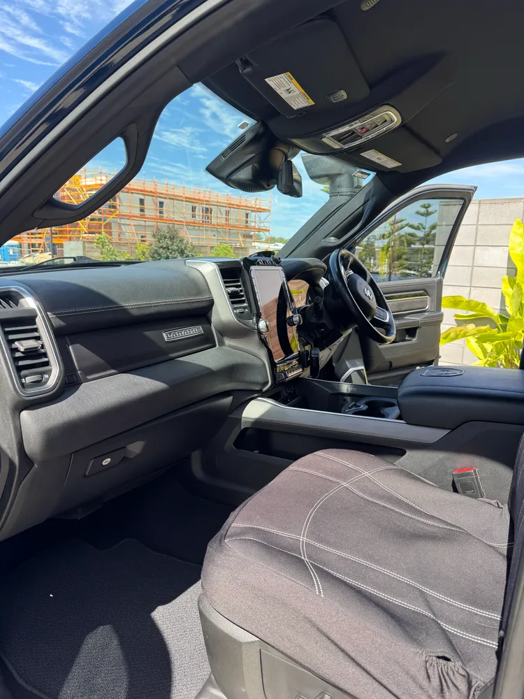 RAM Laramie interior detailed with the dashboard and front seats cleaned