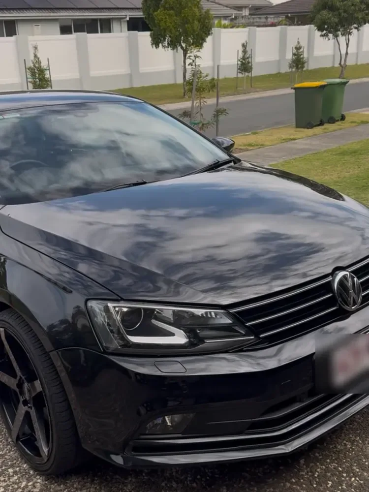 Black Volkswagen Jetta polished to a deep gloss finish